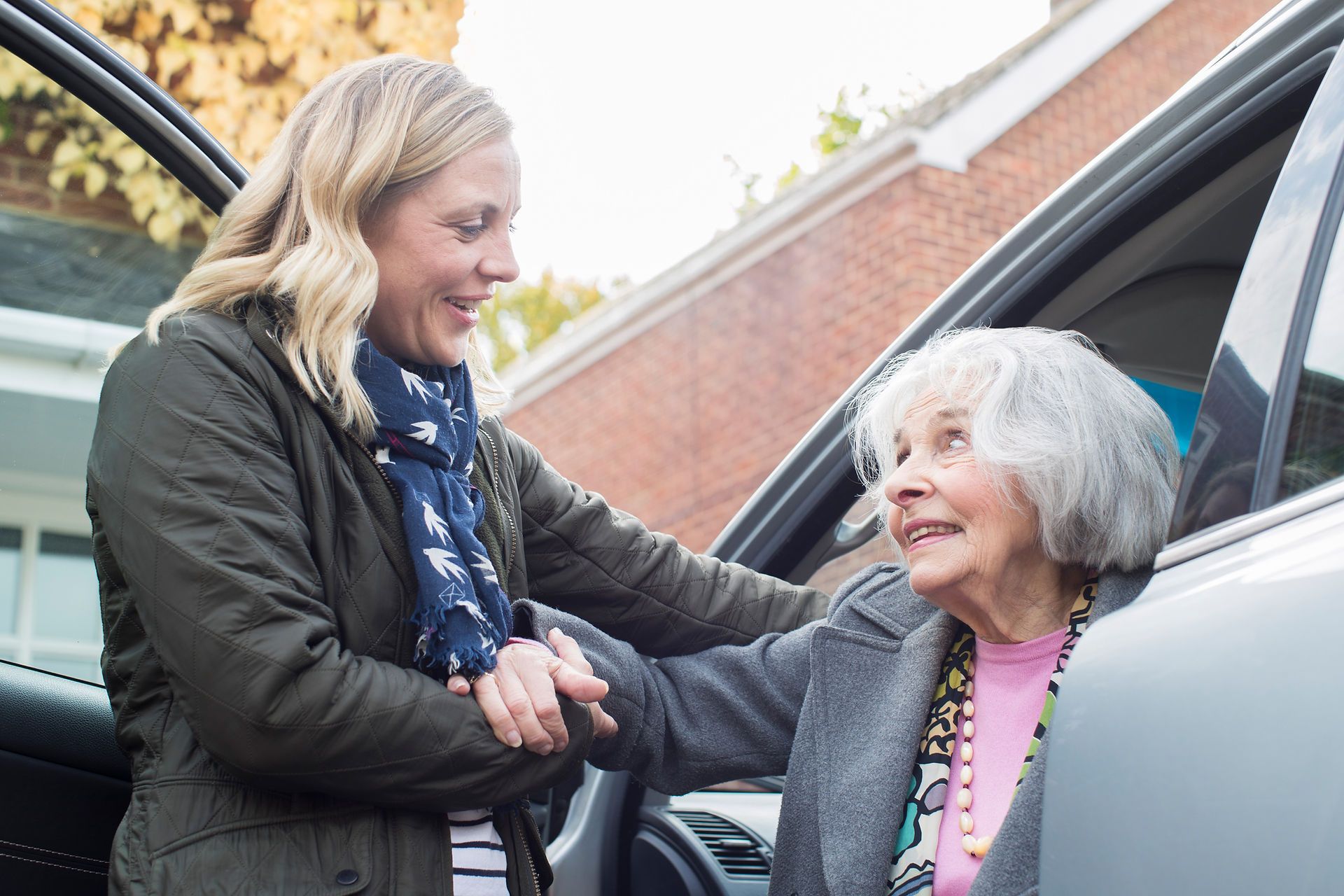 Assisting Elderly Woman